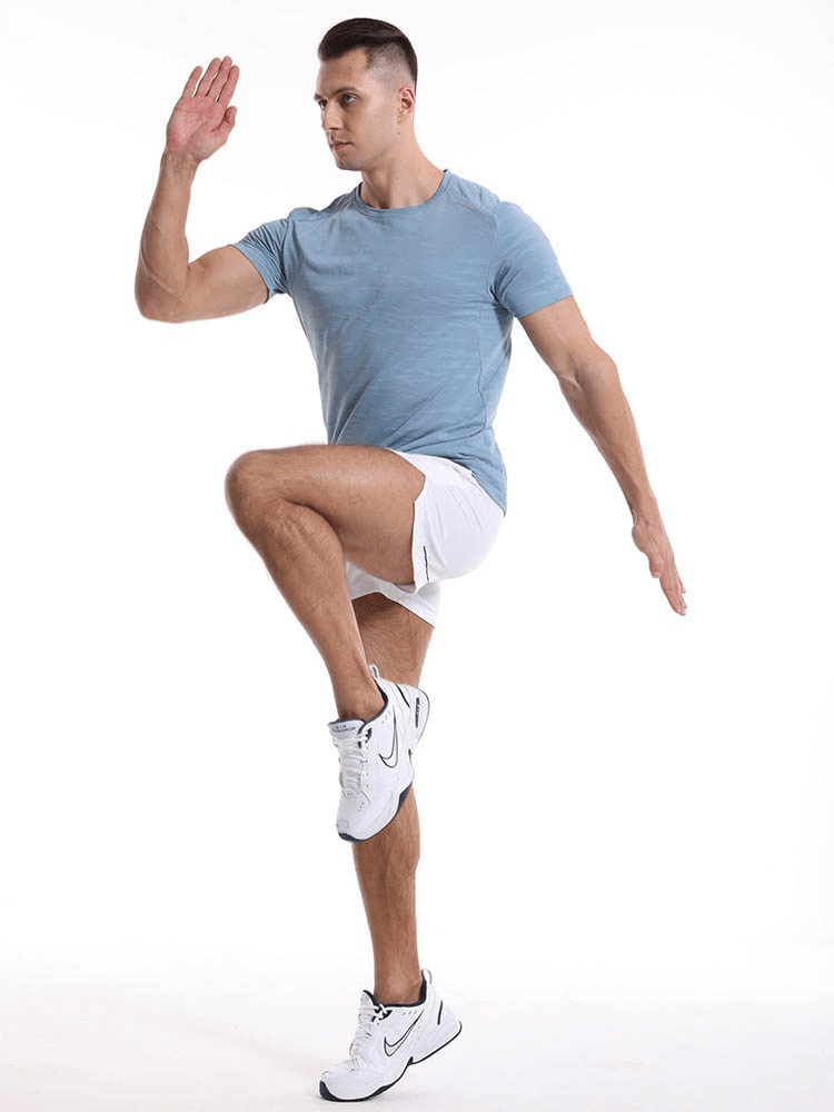 Man wearing Casual Short Sleeves Basketball Elastic T-shirt SF1043 demonstrating athletic pose against white background.